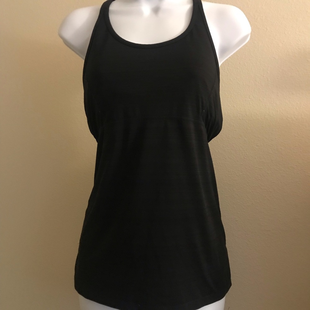 Woman Athleta tank top with built in bra